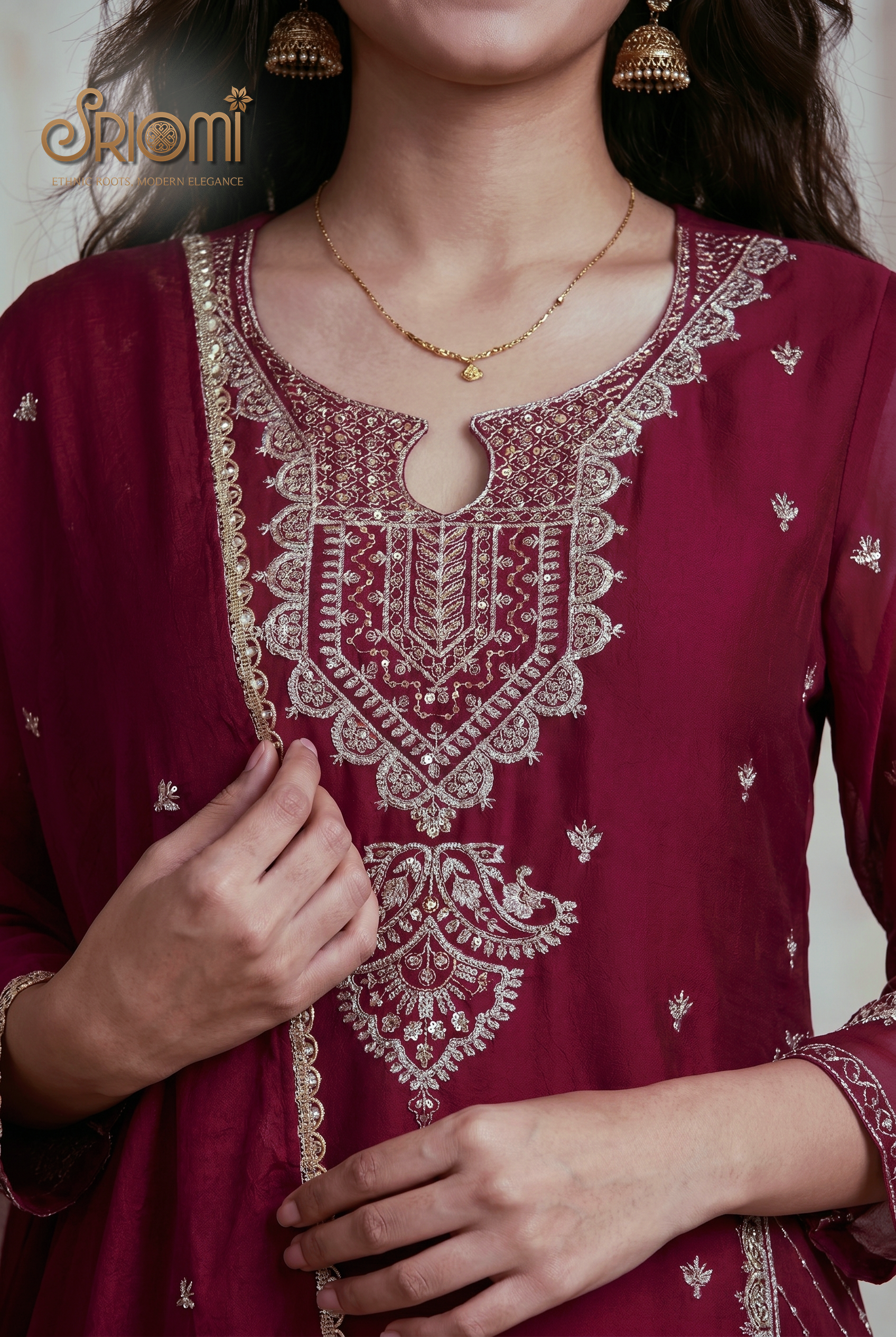 Maroon embroidered kurta with gold detailing worn by a person, brand 'Srioni' visible.