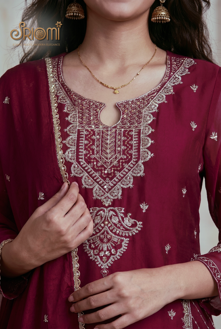 Maroon embroidered kurta with gold detailing worn by a person, brand 'Srioni' visible.